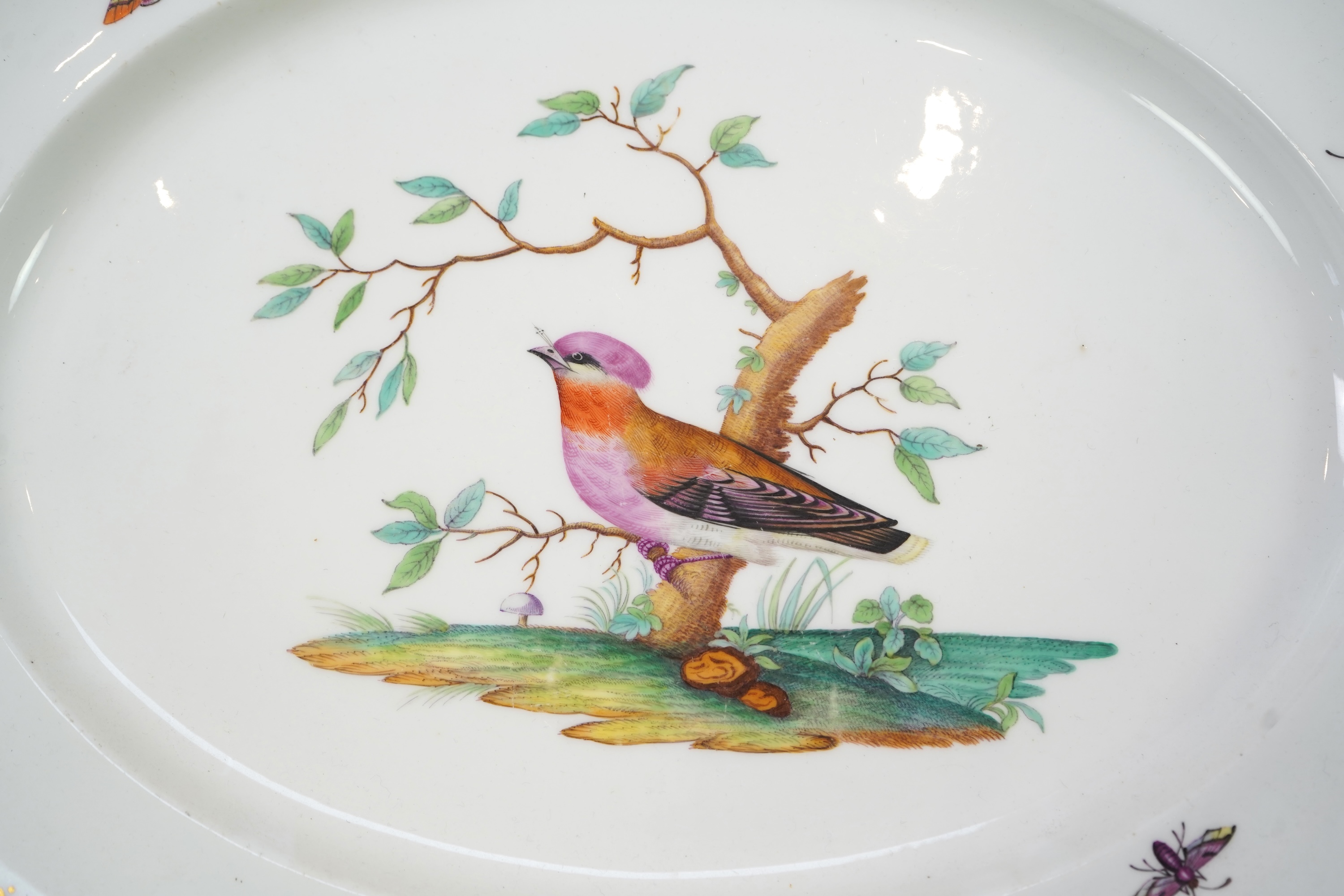 A Coalport bird painted part dinner service, mid 19th century
